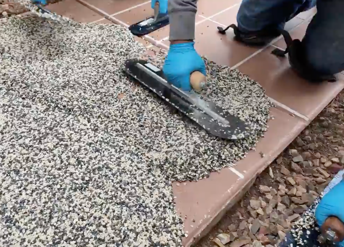Resin Rock crew installing a resin-bound driveway at a modern Florida home