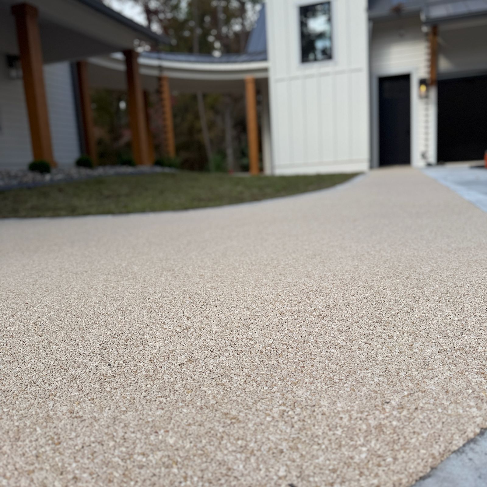 Rock Crete permeable resin bound base being laid over an existing surface